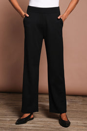 Model Amanda wearing size 10 of The Straight Cut Pull On Ponte Pant in colour Black (Black), from the front, cropped image