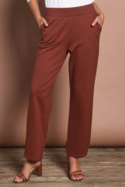 Model Madeline wearing size 10 of The Straight Cut Pull On Ponte Pant in colour Cinnamon, from the front, cropped image