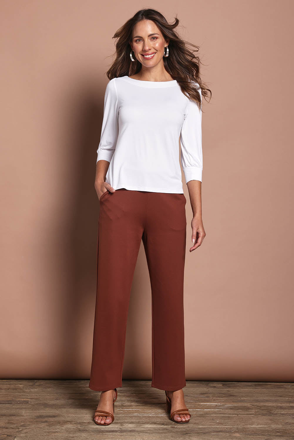 Model Madeline wearing size 10 of The Straight Cut Pull On Ponte Pant in colour Cinnamon, from the front, showing the whole outfit