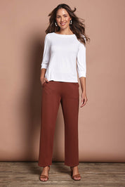 Model Madeline wearing size 10 of The Straight Cut Pull On Ponte Pant in colour Cinnamon, from the front, showing the whole outfit