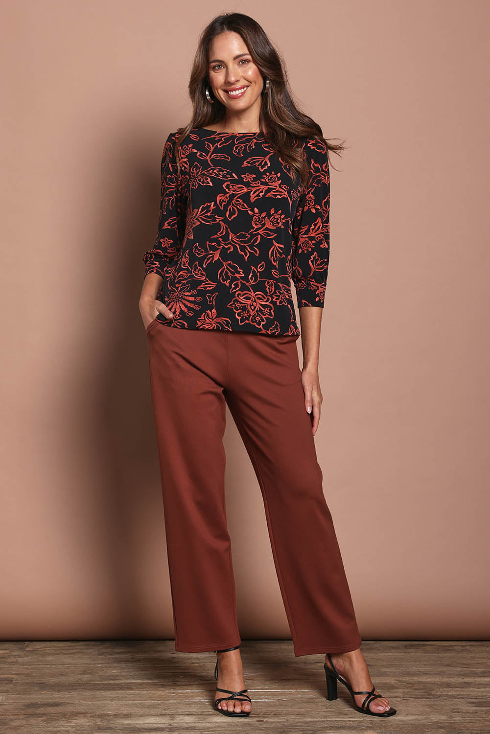 Model Madeline wearing size 10 of The Straight Cut Pull On Ponte Pant in colour Cinnamon, from the front, showing the whole outfit