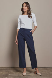 Model Madeline wearing size 10 of The Straight Cut Pull On Ponte Pant in colour Darknavy (Blue), from the front, showing the whole outfit