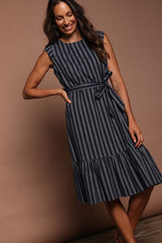 Model Amanda wearing size 10 of The Stripe Cotton Cap Sleeve Dress in colour Navy (Blue), from the front, showing the whole outfit