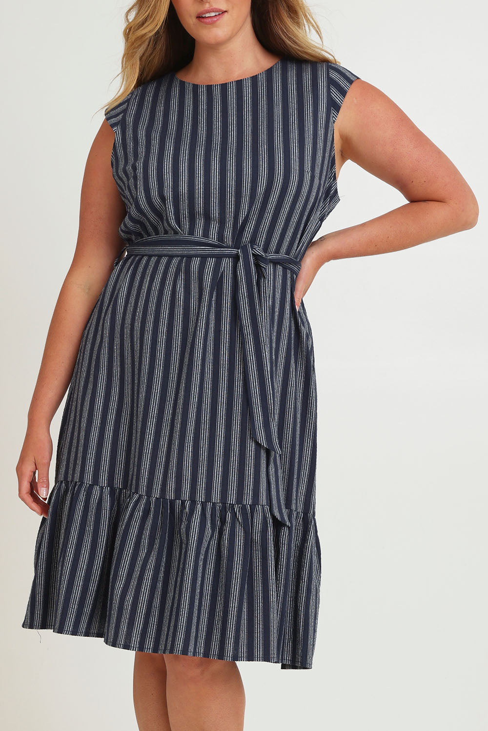 Model Chanel wearing size 16 of The Stripe Cotton Cap Sleeve Dress in colour Navy (Blue), from the front, cropped image