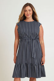 Model Chanel wearing size 16 of The Stripe Cotton Cap Sleeve Dress in colour Navy (Blue), from the front, cropped image