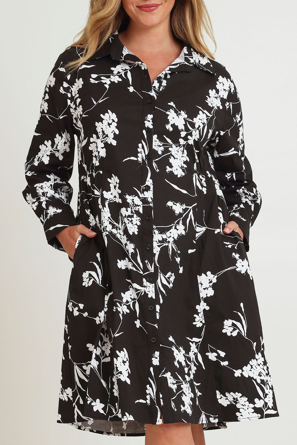 Model Chanel wearing size 16 of The Printed Cotton Stretch Shirt Dress in colour Blackfleur (Black), from the front, cropped image