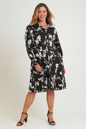 Model Chanel wearing size 16 of The Printed Cotton Stretch Shirt Dress in colour Blackfleur (Black), from the front, showing the whole outfit