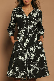 Model Madeline wearing size 10 of The Printed Cotton Stretch Shirt Dress in colour Blackfleur (Black), from the front, cropped image