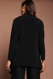 Model Amanda wearing size 10 of The Longline Drape Cardi in colour Black (Black), from the back