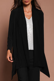 Model Amanda wearing size 10 of The Longline Drape Cardi in colour Black (Black), from the front, cropped image