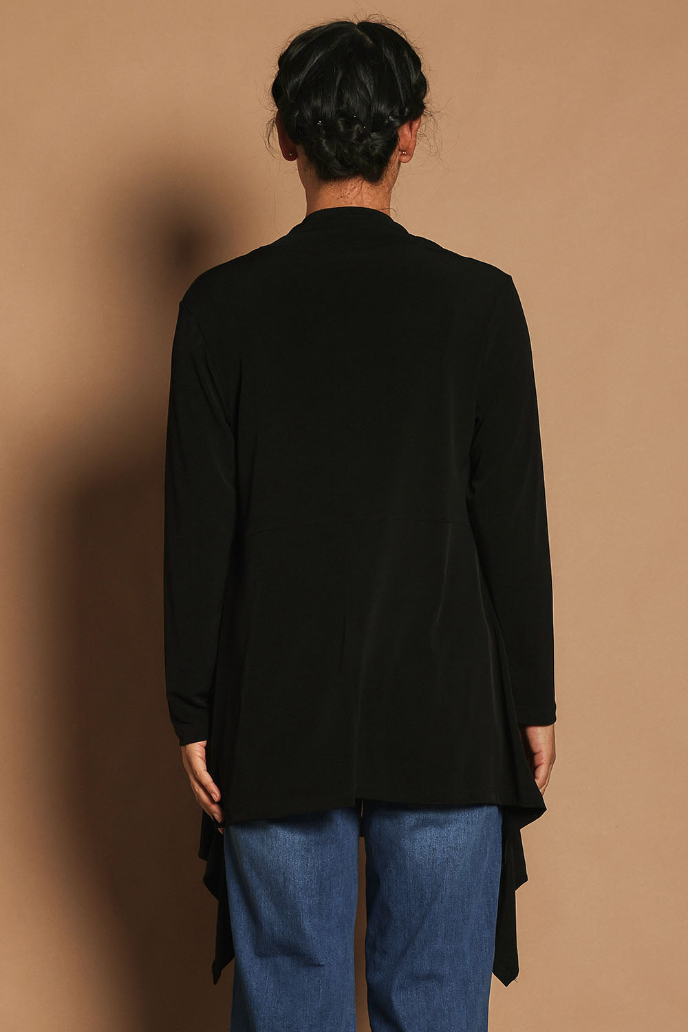 Model Katie wearing size 10 of The Longline Drape Cardi in colour Black (Black), from the back