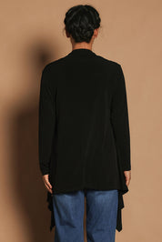 Model Katie wearing size 10 of The Longline Drape Cardi in colour Black (Black), from the back