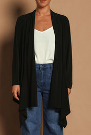 Model Katie wearing size 10 of The Longline Drape Cardi in colour Black (Black), from the front, cropped image