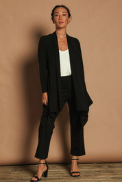 Model Katie wearing size 10 of The Longline Drape Cardi in colour Black (Black), from the front, showing the whole outfit