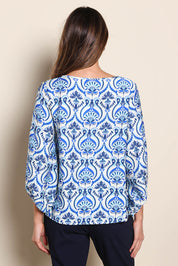 Model Madelinec wearing size 10 of the The Printed Bishop Sleeve Blouse – Bluedamask in colour Bluedamask, from the back