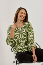 Model Amanda wearing size 10 of The Printed Bishop Sleeve Blouse in colour Green (Green), from the front, showing the whole outfit