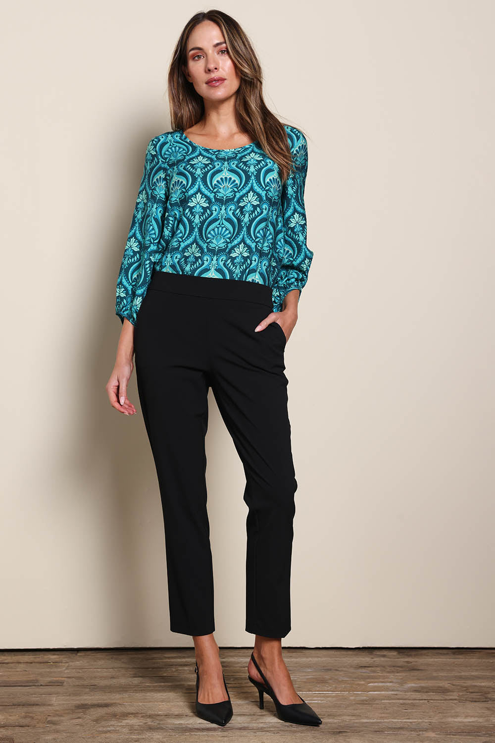 Model Maddiec wearing size 10 of the The Printed Bishop Sleeve Blouse – Tealdamask in colour Tealdamask, from the front