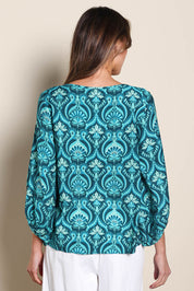 Model Madelinec wearing size 10 of the The Printed Bishop Sleeve Blouse – Tealdamask in colour Tealdamask, from the back
