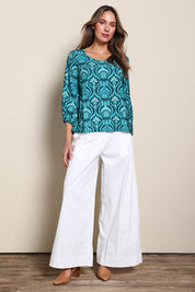 Model Madelinec wearing size 10 of the The Printed Bishop Sleeve Blouse – Tealdamask in colour Tealdamask, from the front