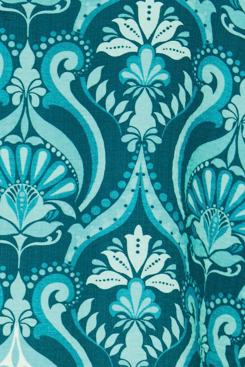 Product shot of the The Printed Bishop Sleeve Blouse – Tealdamask in colour Tealdamask, showing detail