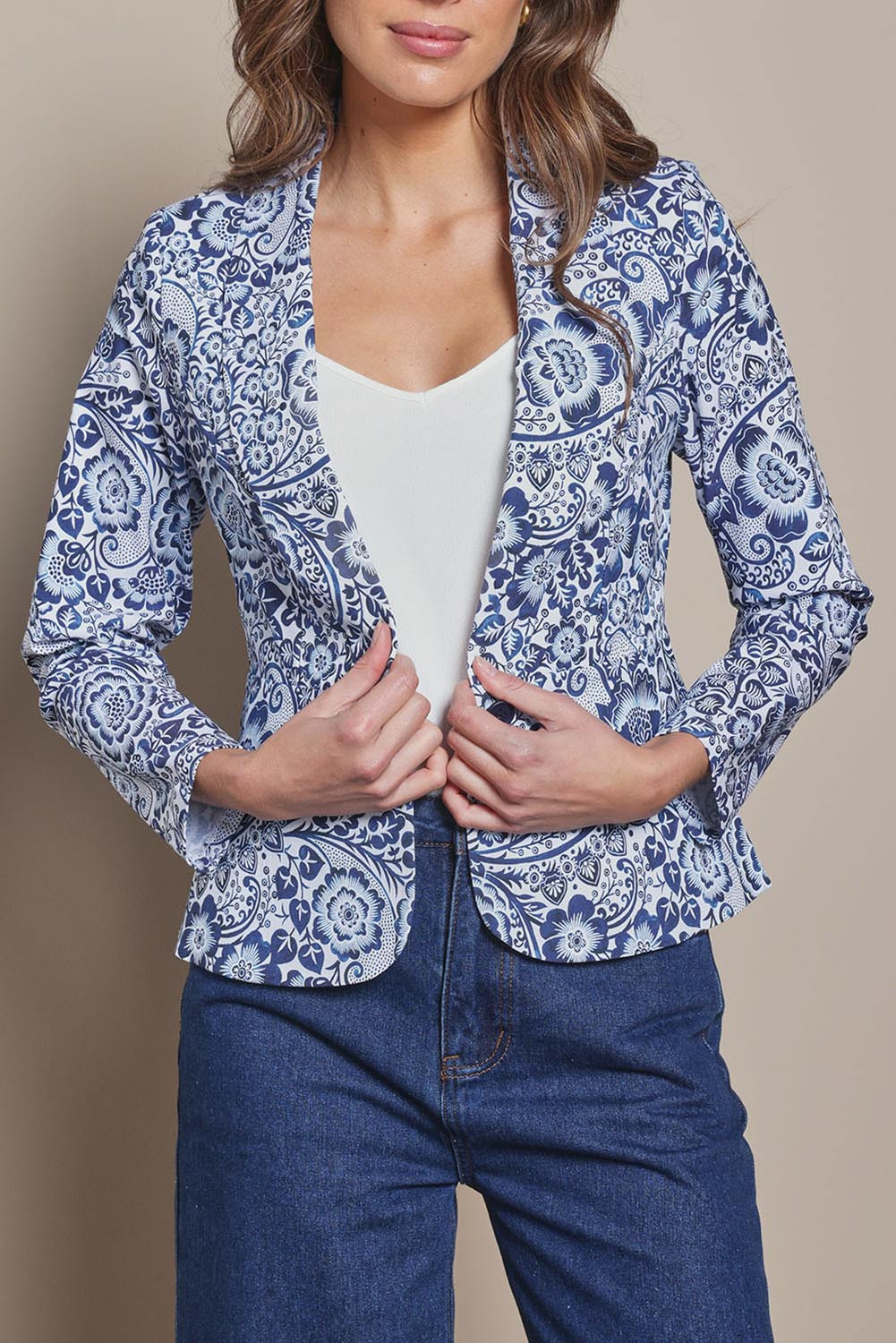 Model Madeline wearing size 10 of The Aspire Blazer in colour Peony (Blue), from the front, cropped image