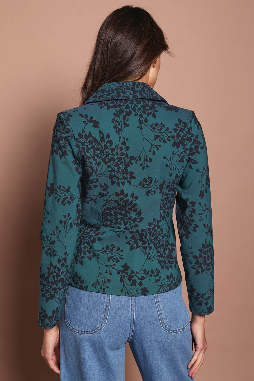 Model Madeline wearing size 10 of The Aspire Blazer in colour Tealbloom (Green), from the back