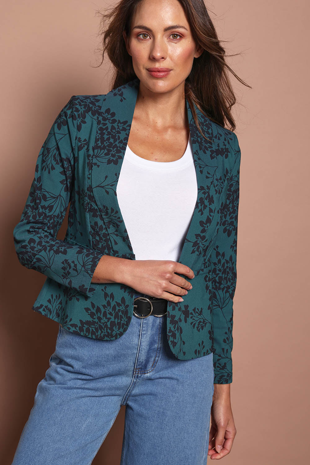 Model Madeline wearing size 10 of The Aspire Blazer in colour Tealbloom (Green), from the front, cropped image