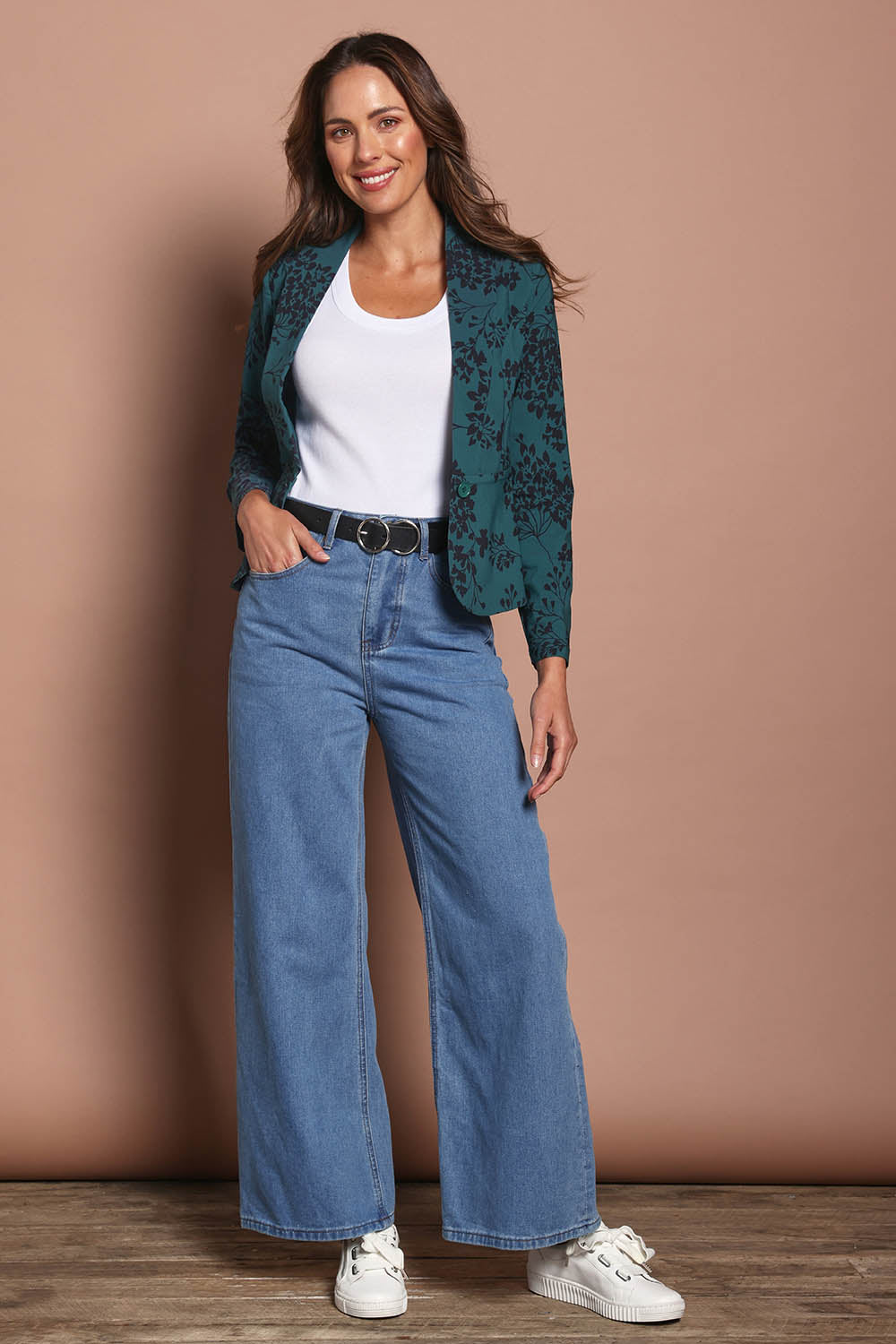 Model Madeline wearing size 10 of The Aspire Blazer in colour Tealbloom (Green), from the front, showing the whole outfit