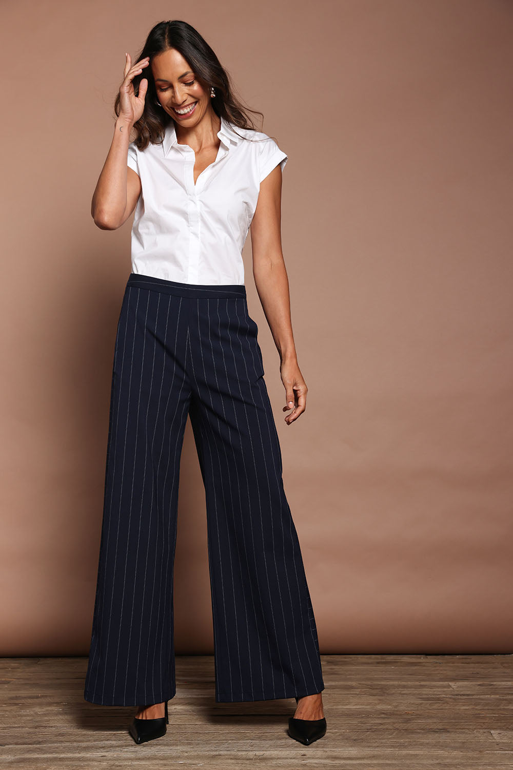 Model Amanda wearing size 10 of The Wide Leg Stripe Pant in colour Navy (Blue), from the front, showing the whole outfit