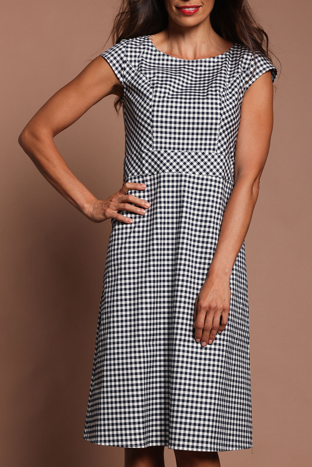 Model Amanda wearing size 10 of The Cotton Stretch Gingham Dress in colour Gingham (Black), from the front, cropped image