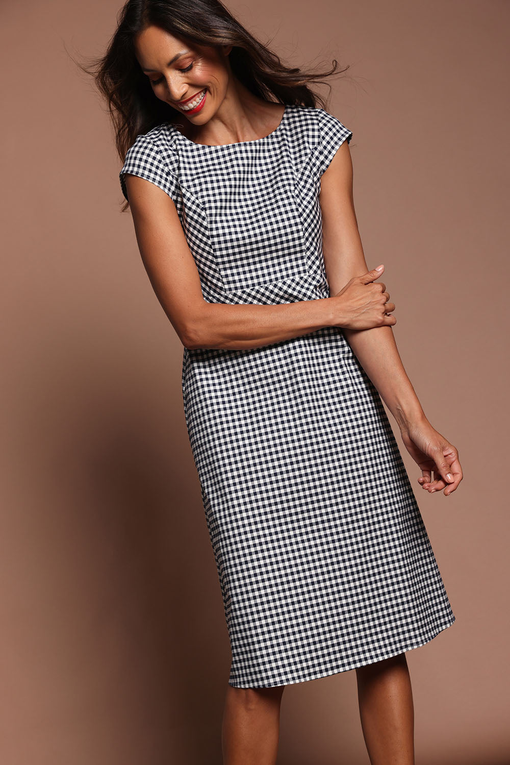 Model Amanda wearing size 10 of The Cotton Stretch Gingham Dress in colour Gingham (Black), from the front, showing the whole outfit