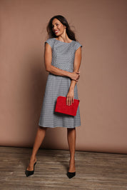Model Amanda wearing size 10 of The Cotton Stretch Gingham Dress in colour Gingham (Black), from the front, showing the whole outfit