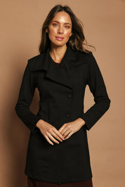 Model Madeline wearing size 10 of The Ponte Longline Collar Jacket in colour Black (Black), from the front, showing the whole outfit