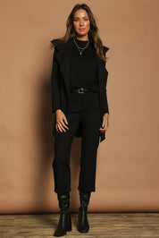 Model Madeline wearing size 10 of The Ponte Longline Collar Jacket in colour Black (Black), from the front, showing the whole outfit