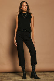 Model Madeline wearing size 10 of The Ponte Tailored 7/8 Pant in colour Black (Black), from the front, showing the whole outfit
