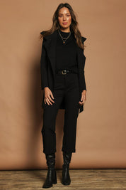 Model Madeline wearing size 10 of The Ponte Tailored 7/8 Pant in colour Black (Black), from the front, showing the whole outfit