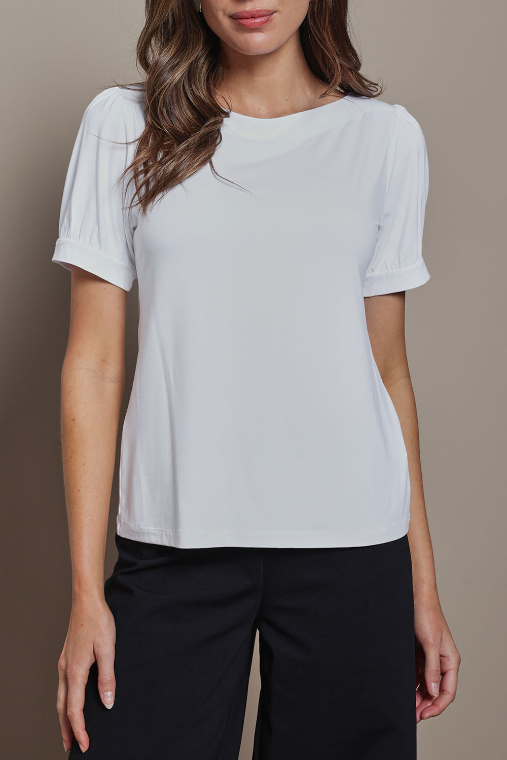 Model Madeline wearing size 10 of The Bamboo Boat Neck Short Sleeve Top in colour Snow (White), from the front, cropped image