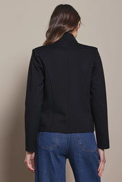 Model Madeline wearing size 10 of The Reverse Lapel Ponte Blazer in colour Jetblack (Black), from the back
