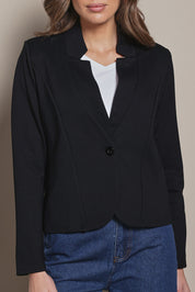 Model Madeline wearing size 10 of The Reverse Lapel Ponte Blazer in colour Jetblack (Black), from the front, cropped image