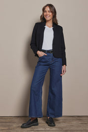 Model Madeline wearing size 10 of The Reverse Lapel Ponte Blazer in colour Jetblack (Black), from the front, showing the whole outfit