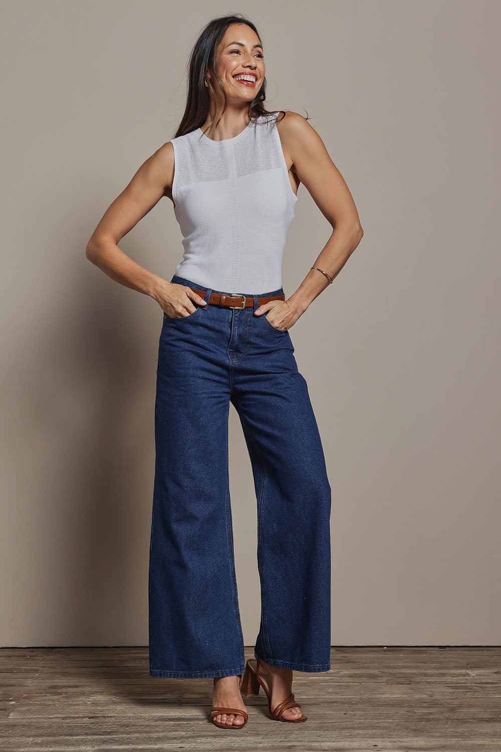 Model Amanda wearing size S of The Linen Blend Seamless Knit Tank in colour Milk (White), from the front, showing the whole outfit