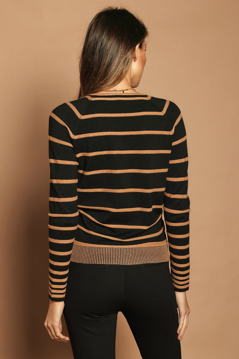 Model Madeline wearing size S of The Stripe Faux Wrap Jumper in colour Blacktan (Black), from the back