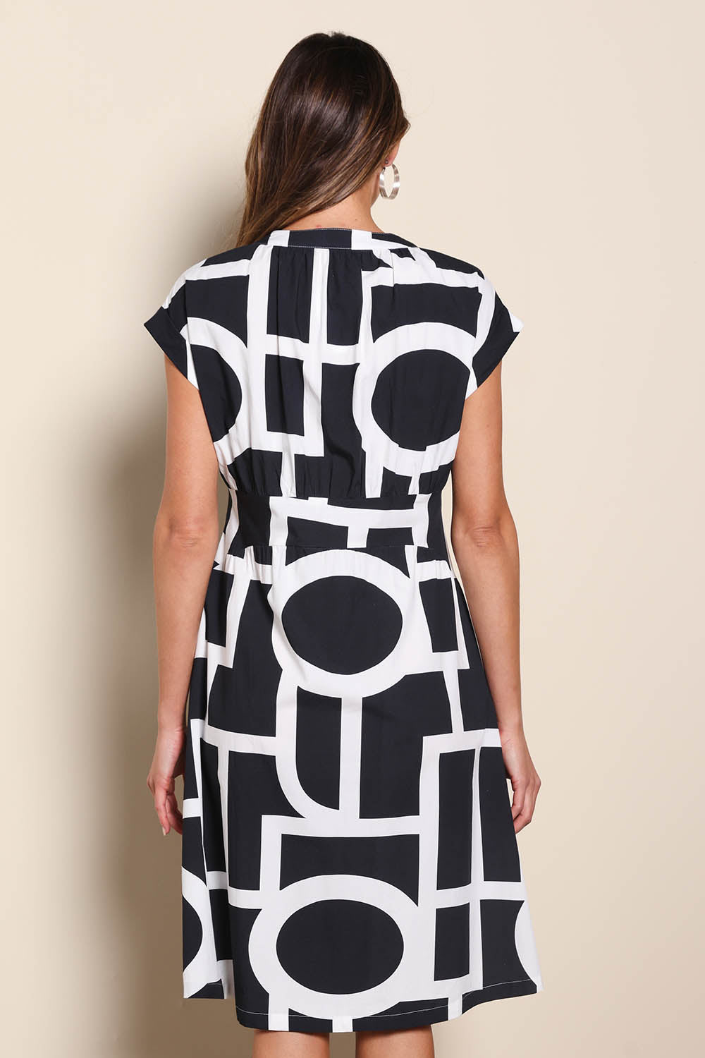 Model Madelinec wearing size 10 of the The Printed Cotton Blend Shirt Dress - Blackwhite in colour Blackwhite, from the back
