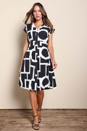 Model Madelinec wearing size 10 of the The Printed Cotton Blend Shirt Dress - Blackwhite in colour Blackwhite, from the front