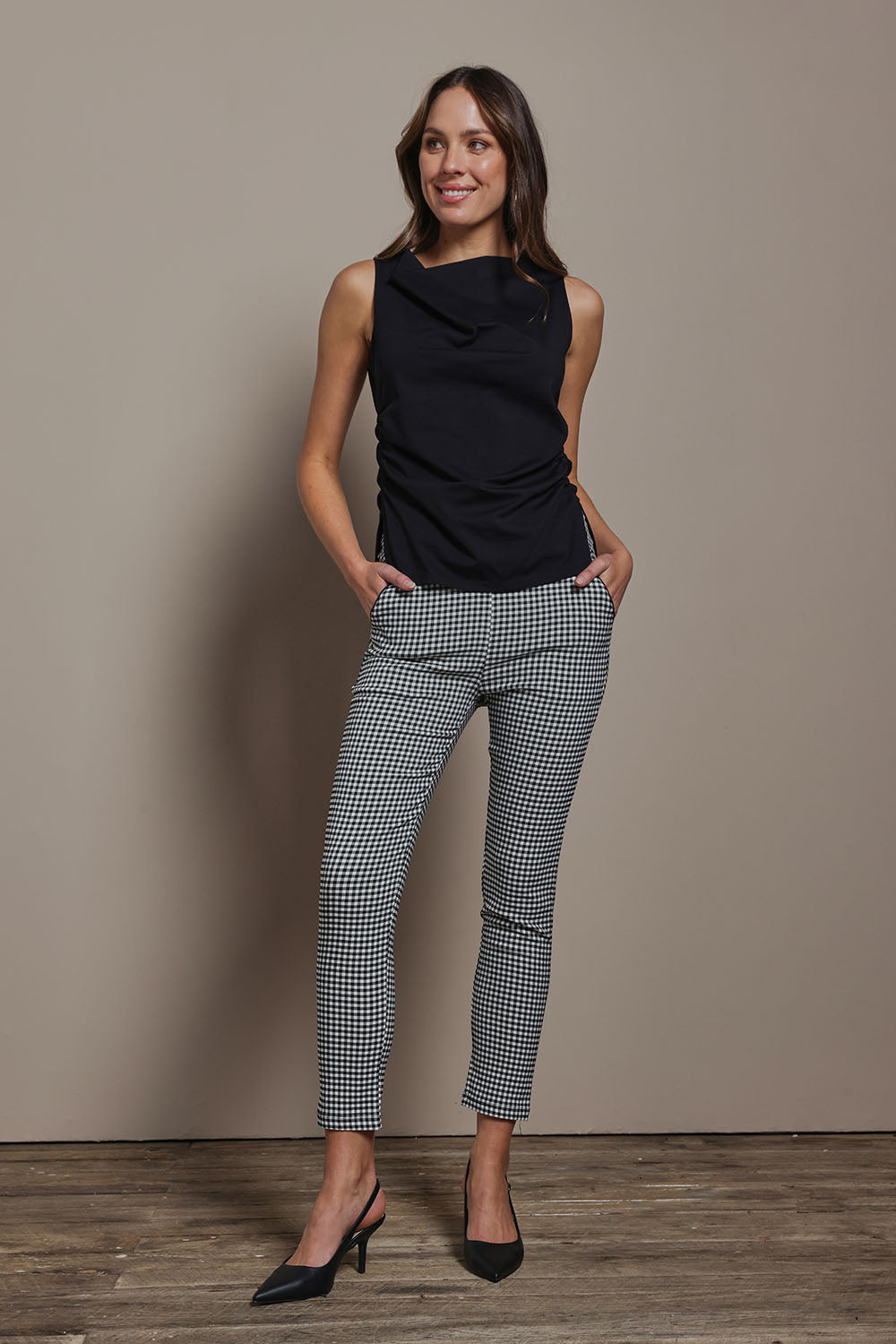 Model Madeline wearing size 10 of The Cotton Blend Ruched Waist Top in colour Black (Black), from the front, showing the whole outfit