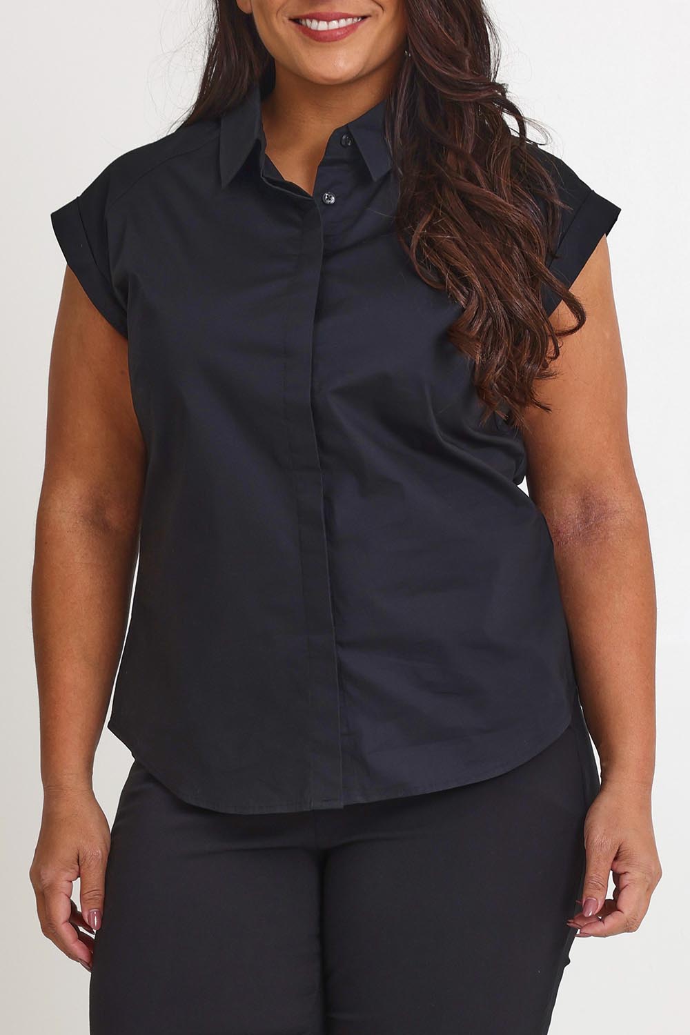 Model Ashleigh wearing size 16 of The Cap Sleeve Cotton Stretch Shirt in colour Black (Black), from the front, cropped image