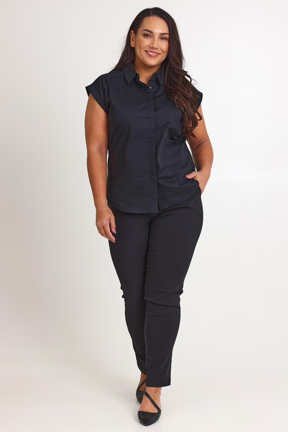 Model Ashleigh wearing size 16 of The Cap Sleeve Cotton Stretch Shirt in colour Black (Black), from the front, showing the whole outfit