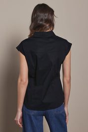 Model Madeline wearing size 10 of The Cap Sleeve Cotton Stretch Shirt in colour Black (Black), from the back