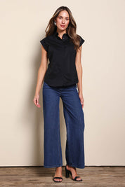 Model Madelinec wearing size 10 of the The Cap Sleeve Cotton Stretch Shirt - Black in colour Black, from the front