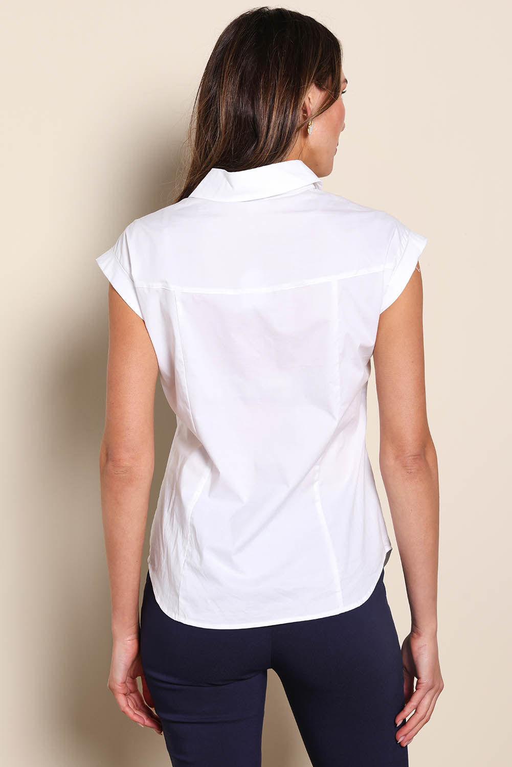 Model Madelinec wearing size 10 of the The Cap Sleeve Cotton Stretch Shirt - White in colour White, from the back